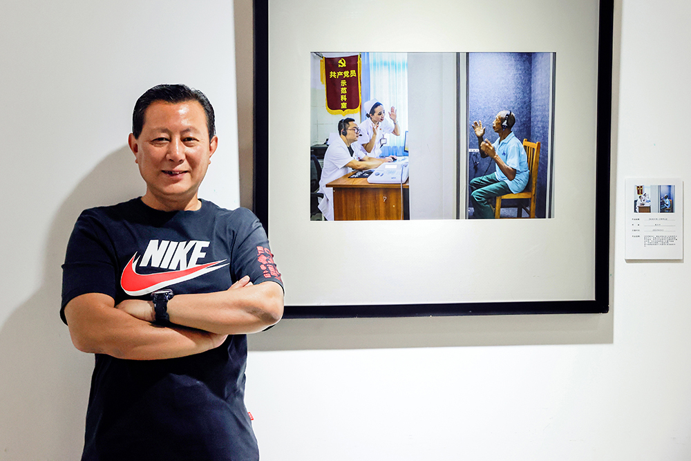 【红网时刻·湖南频道】临武县文化馆副馆长陈卫平摄影作品《就地评残暖心田》入展第十三届中国艺术节